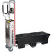 A Magliner hand truck with a black plastic container on it.