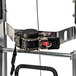 A close up of a Magliner appliance truck handle release with a black strap.