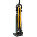 A green Bissell Commercial dual motor commercial bagged upright vacuum cleaner with yellow cords and on-board tools.