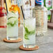 Two glasses of Finest Call sugar syrup with ice, lime, and mint.