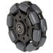 A black and grey Magliner Rotocaster wheel.