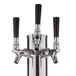 A silver metal Assure beer tower with three black faucet handles.