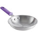 A Choice aluminum fry pan with a purple silicone handle.