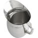 An American Metalcraft stainless steel pitcher with a handle.