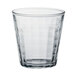 A clear glass Duralex tumbler with a textured pattern.