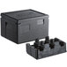 A black plastic Cambro Cam GoBox food pan carrier with cup holders and handles.