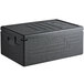 A black plastic Cambro Cam GoBox top loading food pan carrier with lid.