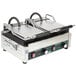 A Waring Tostato Ottimo panini grill with two metal plates.