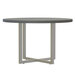 A round Safco Mirella conference table with a stone grey top and metal legs.