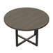 A Safco Mirella round conference table with a black cross base and wooden top.