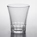A Duralex Amalfi clear glass with a curved rim on a white surface.