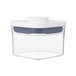 A clear plastic square OXO Good Grips food storage container with a white lid.