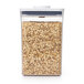 A white OXO Good Grips food storage container full of oats.