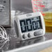 A CDN digital kitchen timer on a counter.