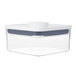 A clear plastic OXO Good Grips mini square food storage container with a white lid.