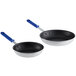 Two Vollrath Wear-Ever aluminum frying pans with blue Cool Handles.