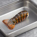 A Boston Lobster Company 5-6 oz. lobster tail in a stainless steel pan.