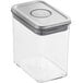 An OXO clear plastic rectangular food storage container with a stainless steel lid.
