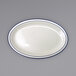 An International Tableware ivory stoneware platter with blue bands on the rim.