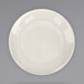 An International Tableware Roma stoneware plate with a wide white rim on a gray background.