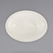 An ivory oval serving bowl with a narrow rim.