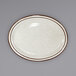 An International Tableware ivory stoneware platter with brown speckled narrow rim.