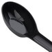 A close-up of a black plastic spoon with a handle.