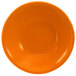 An orange stoneware bowl.