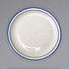 An ivory stoneware plate with a blue speckled and blue banded rim.