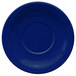 A cobalt blue International Tableware saucer with a circle in the center.