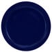 A cobalt blue stoneware plate with a narrow rim.