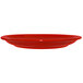 A crimson red International Tableware stoneware plate with a narrow rim.