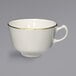 An International Tableware ivory stoneware cup with a gold rim.
