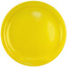 A yellow stoneware plate with a white center and yellow rim.