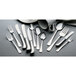 A close-up of Vollrath Queen Anne stainless steel dinner forks.