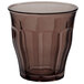 A brown glass cup with a clear bottom on a white background.
