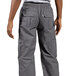 A man wearing Uncommon Chef slate gray cargo pants.