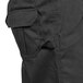 A close up of a black cargo chef pants pocket.