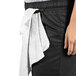 Uncommon Chef women's black chef pants with a towel on the waist.