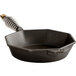 A black cast iron pan with a metal handle.