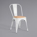 A Lancaster Table & Seating white indoor cafe chair with a natural wood seat.