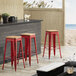 Lancaster Table & Seating Alloy Series Distressed Red Metal Indoor Industrial Cafe Bar Height Stool with Natural Wood Seat Main Thumbnail 1