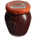 A close-up of a jar of Dalmatia Black Olive Spread with a red lid.