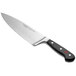 A Wusthof Classic 8" wide cook's knife with a black handle.