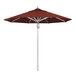 A California Umbrella with a red Sunbrella canopy on a pole.