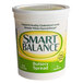 A case of 6 white Smart Balance containers of butter spread with green and yellow labels.