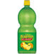 A green bottle of ReaLemon 100% lemon juice on a table.
