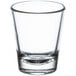 A clear Libbey shot glass on a white background.