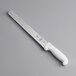 A Mercer Culinary Ultimate White 11" Serrated Edge Slicer Knife with a white handle.