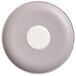 A white porcelain saucer with a gray speckled rim.